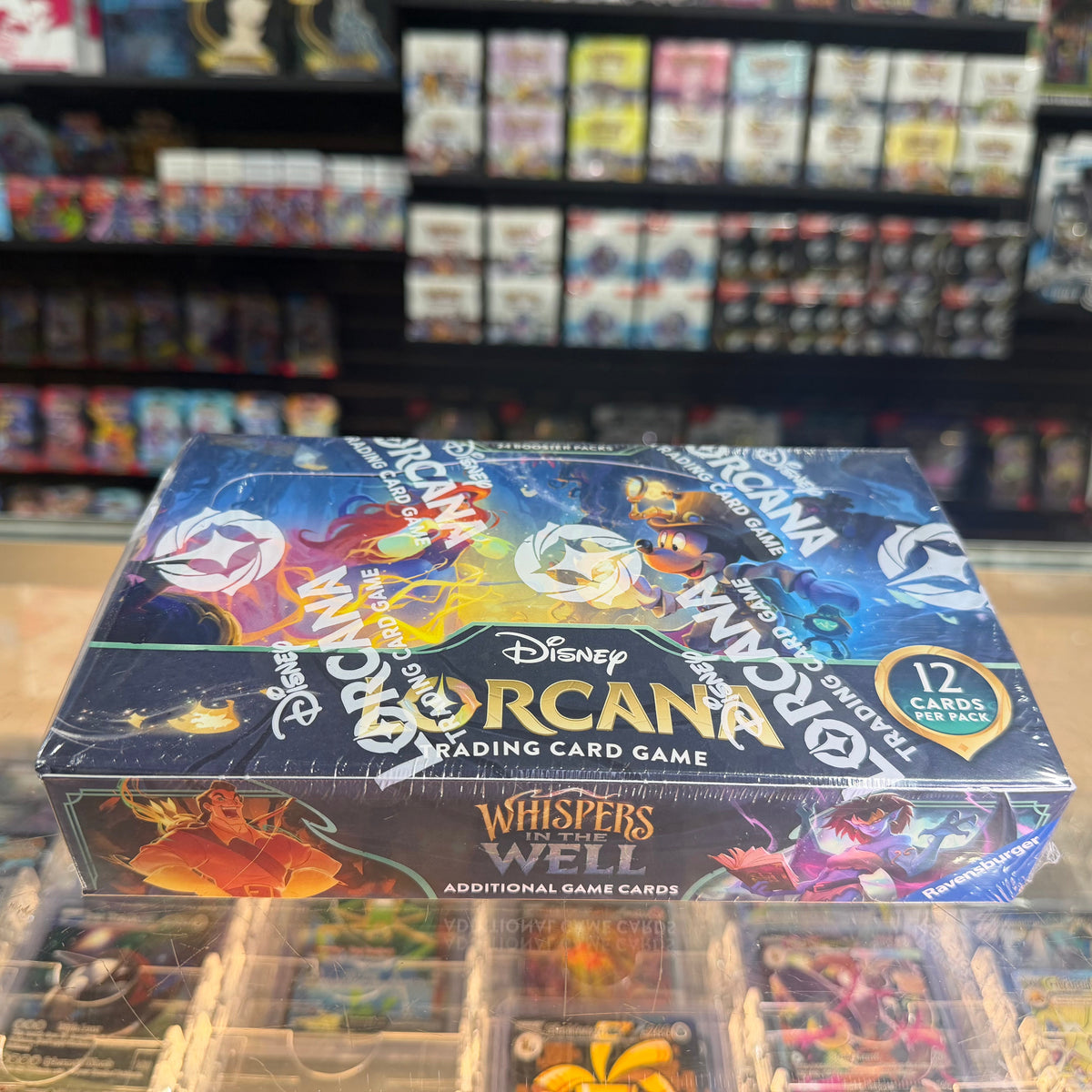 Stock image of Whispers in the Well Lorcana Booster Box. May not accurately reflect the condition of the actual product.